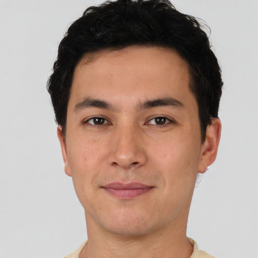 Joyful latino young-adult male with short  brown hair and brown eyes