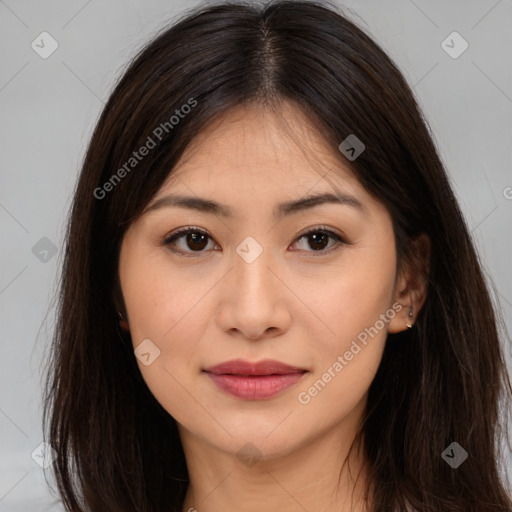 Joyful asian young-adult female with long  brown hair and brown eyes