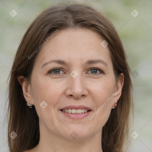 Joyful white adult female with medium  brown hair and grey eyes