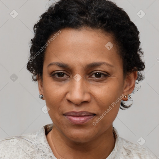 Joyful black adult female with short  brown hair and brown eyes