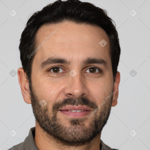 Joyful white young-adult male with short  black hair and brown eyes