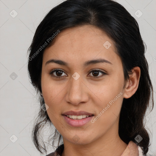 Joyful latino young-adult female with medium  brown hair and brown eyes