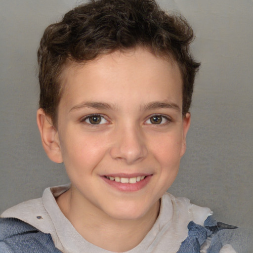 Joyful white child male with short  brown hair and brown eyes