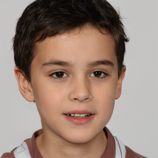 Joyful white child male with short  brown hair and brown eyes