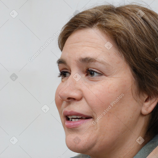 Joyful white adult female with short  brown hair and brown eyes