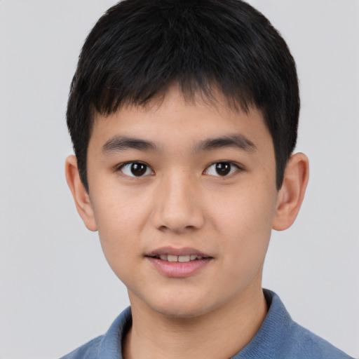 Joyful white child male with short  brown hair and brown eyes