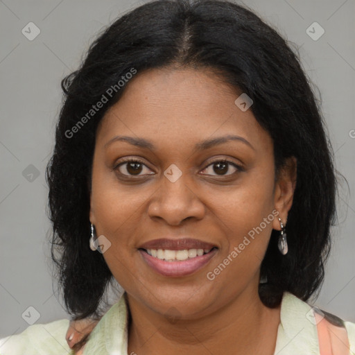 Joyful black young-adult female with medium  brown hair and brown eyes