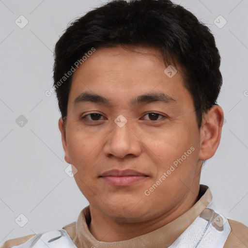 Joyful asian young-adult male with short  brown hair and brown eyes