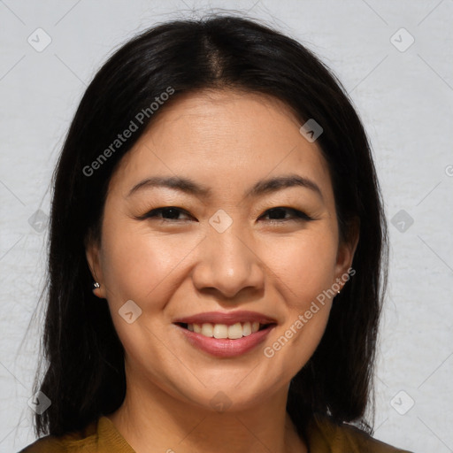 Joyful asian young-adult female with long  brown hair and brown eyes