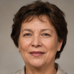 Joyful white middle-aged female with medium  brown hair and brown eyes