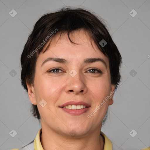 Joyful white adult female with short  brown hair and brown eyes