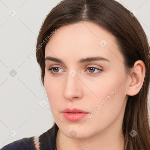 Neutral white young-adult female with long  brown hair and brown eyes