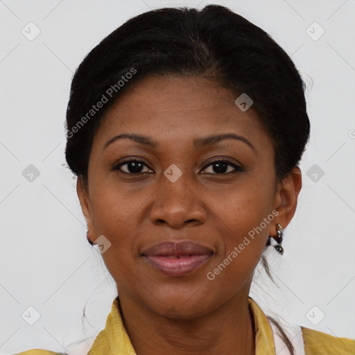 Joyful black adult female with short  brown hair and brown eyes