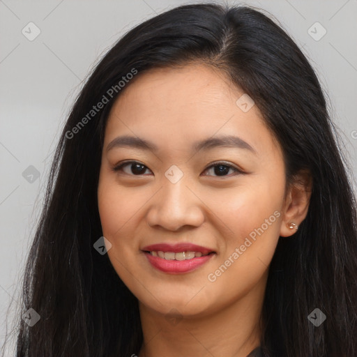 Joyful latino young-adult female with long  brown hair and brown eyes