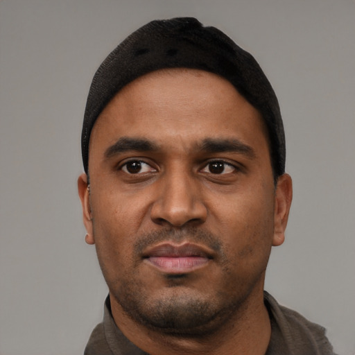 Neutral black young-adult male with short  black hair and brown eyes
