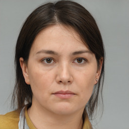 Neutral white young-adult female with medium  brown hair and brown eyes