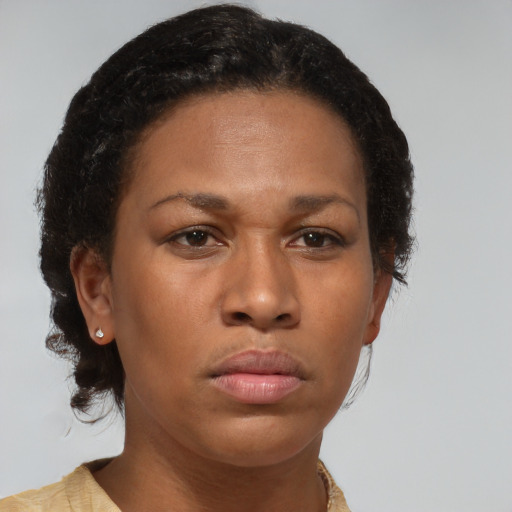 Neutral black young-adult female with medium  brown hair and brown eyes