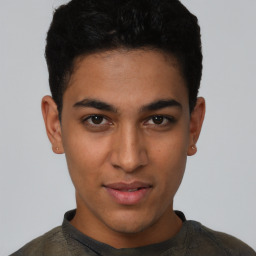 Joyful latino young-adult male with short  black hair and brown eyes