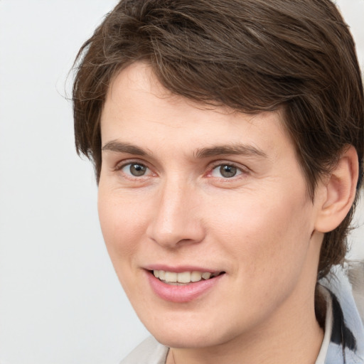 Joyful white young-adult male with medium  brown hair and brown eyes