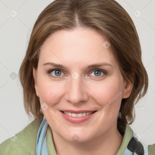 Joyful white young-adult female with medium  brown hair and blue eyes