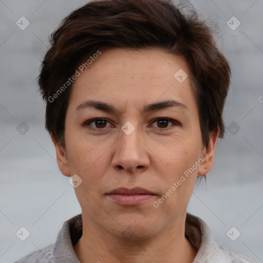 Joyful white adult female with short  brown hair and brown eyes