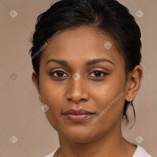 Joyful black young-adult female with short  brown hair and brown eyes