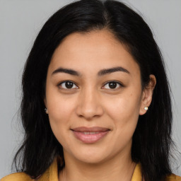 Joyful asian young-adult female with long  brown hair and brown eyes