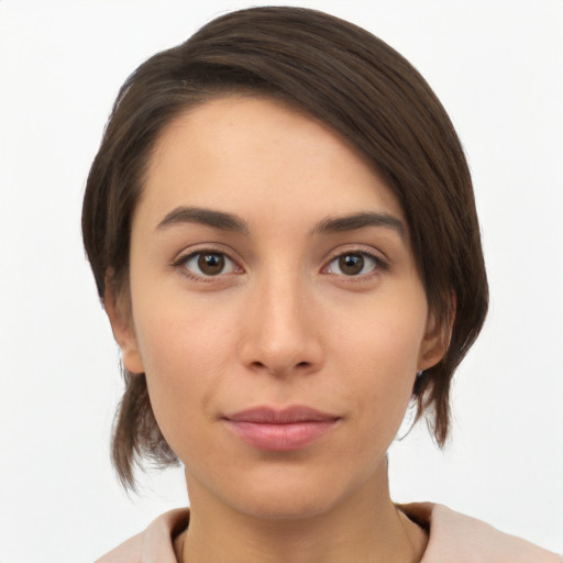 Neutral white young-adult female with medium  brown hair and brown eyes