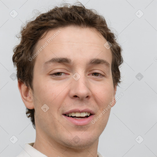 Joyful white adult male with short  brown hair and grey eyes