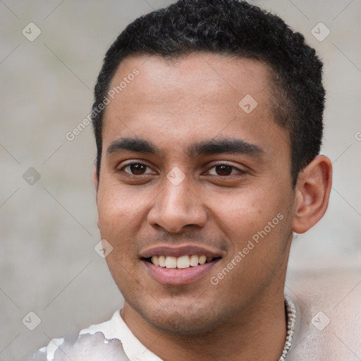 Joyful white young-adult male with short  black hair and brown eyes