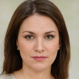 Joyful white young-adult female with medium  brown hair and green eyes