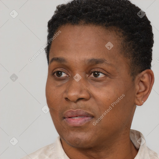 Joyful black adult male with short  black hair and brown eyes