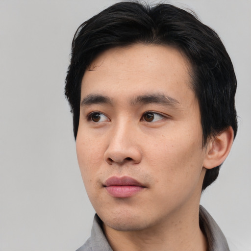 Neutral asian young-adult male with short  black hair and brown eyes