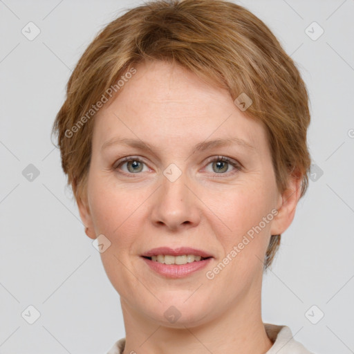 Joyful white adult female with short  brown hair and grey eyes