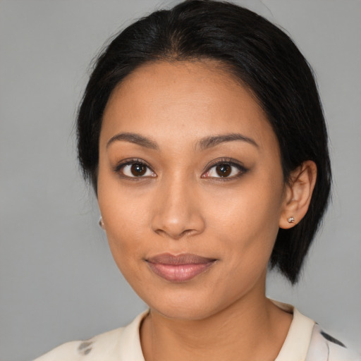 Joyful latino young-adult female with medium  black hair and brown eyes