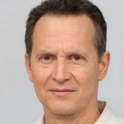 Joyful white middle-aged male with short  brown hair and brown eyes