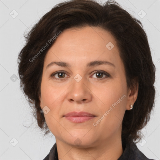 Joyful white adult female with medium  brown hair and brown eyes