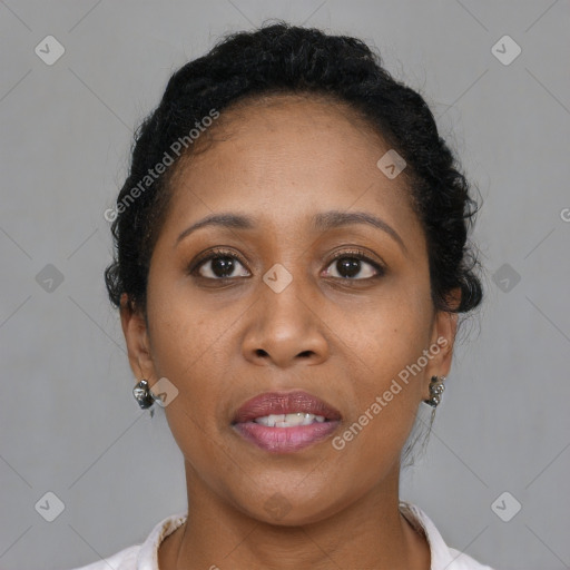 Joyful black adult female with short  brown hair and brown eyes
