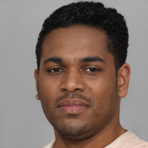 Neutral black young-adult male with short  black hair and brown eyes