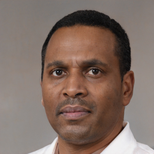 Neutral black adult male with short  black hair and brown eyes