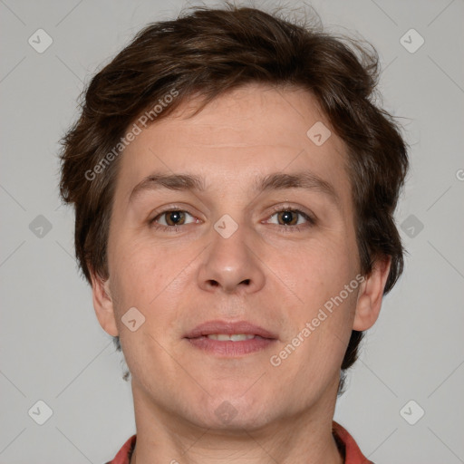 Joyful white adult male with short  brown hair and grey eyes