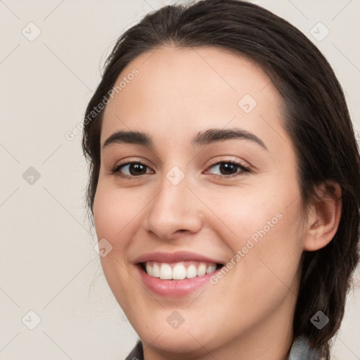 Joyful white young-adult female with medium  brown hair and brown eyes