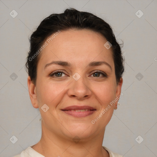 Joyful white adult female with short  brown hair and brown eyes