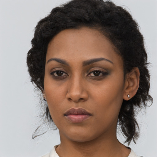 Neutral latino young-adult female with long  black hair and brown eyes