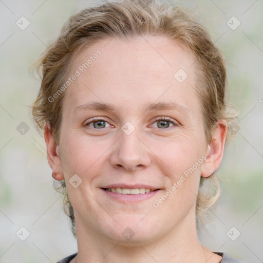 Joyful white young-adult female with medium  brown hair and blue eyes