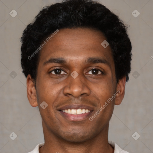 Joyful black young-adult male with short  black hair and brown eyes