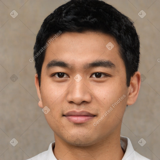 Joyful asian young-adult male with short  black hair and brown eyes