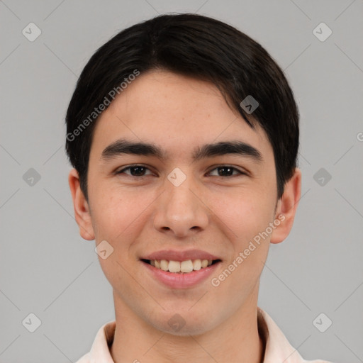 Joyful white young-adult male with short  black hair and brown eyes