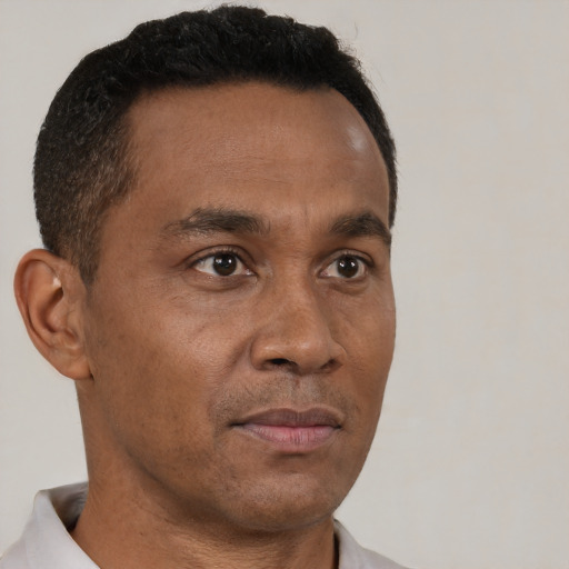 Neutral black adult male with short  brown hair and brown eyes