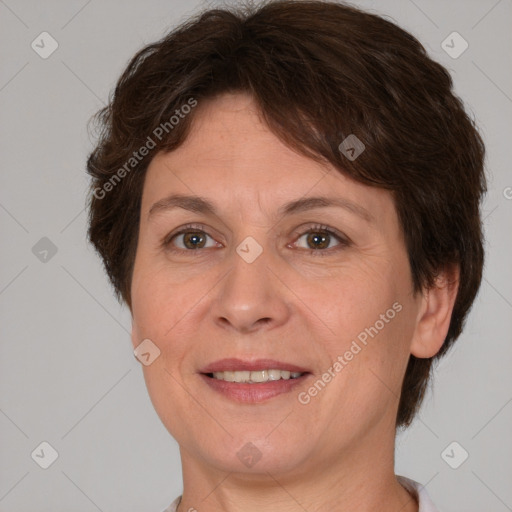 Joyful white adult female with short  brown hair and brown eyes